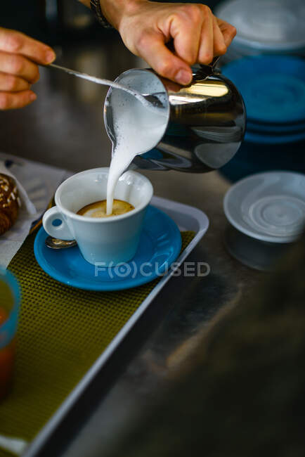 Hands of young adult caucasian female barista at work preparing — Stock Photo