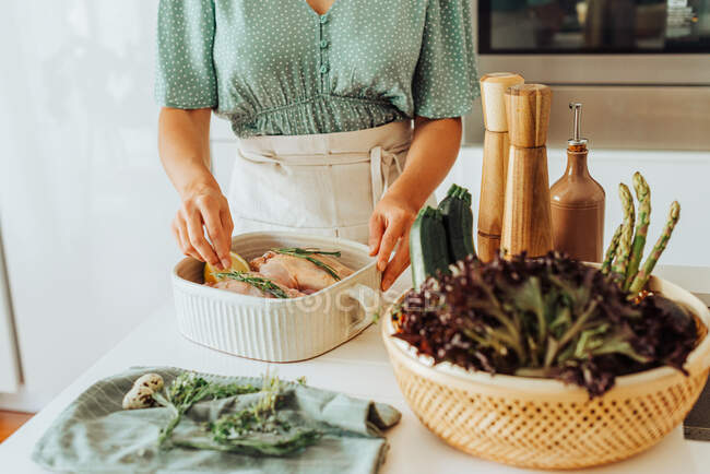 Female hands holding thyme for seasoning food — Stock Photo