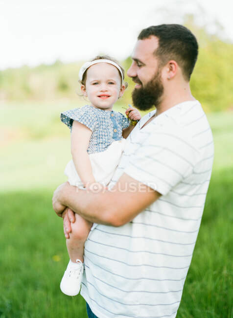 An analog film portrait of a father and his one year old daughter — Stock Photo