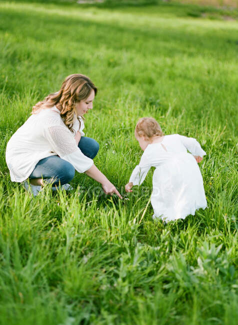A mother and her daughter playing together — Stock Photo