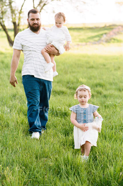 An analog portrait of a father with his hands full — Stock Photo
