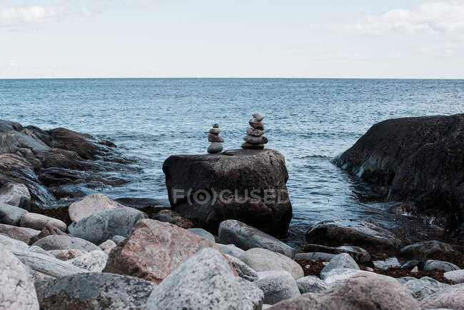 Stacked rocks by the ocean in Sweden — Stock Photo