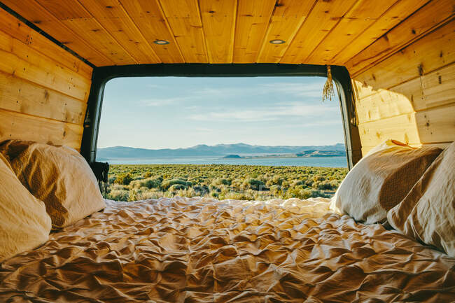 Scenic view of pacific ocean over cliffs from bed of a sprinter van in Baja, Mexico. — Stock Photo