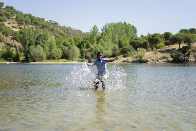 Young man enjoying a day in the river — Stock Photo