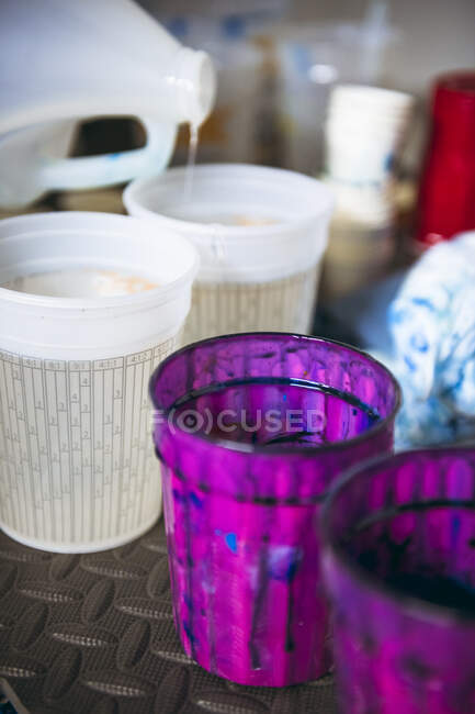 Resin artist materials and mixing cup details — Stock Photo
