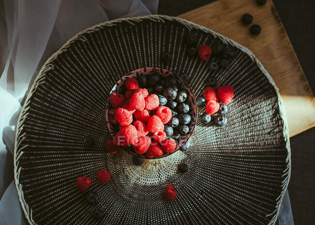 Fresh blueberries and raspberries. Top view — Stock Photo
