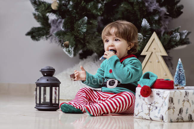 A12 month old baby dressed as elf  at home — Stock Photo