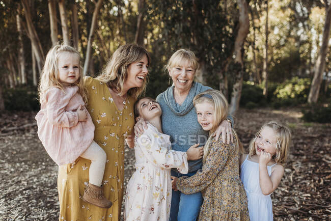 Portrait of Multigenerational Family of Women Embracing Outside — Stock Photo