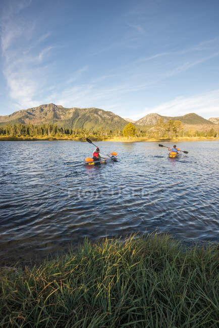 A man and woman kayaking on Lake Tahoe, CA — Stock Photo