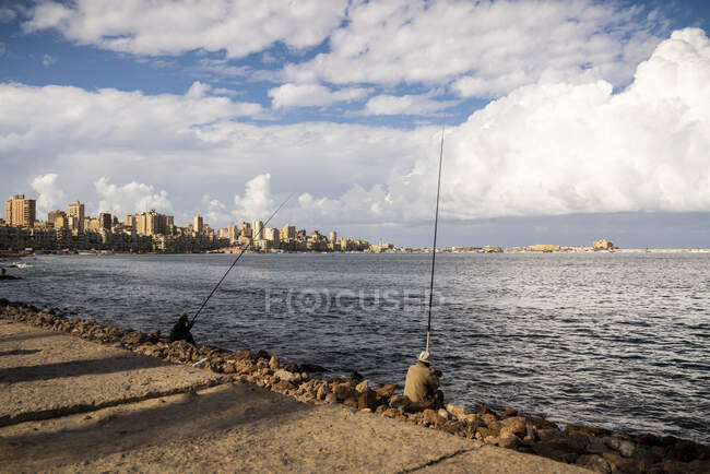Two fishermen in Alexandria harbor — Stock Photo