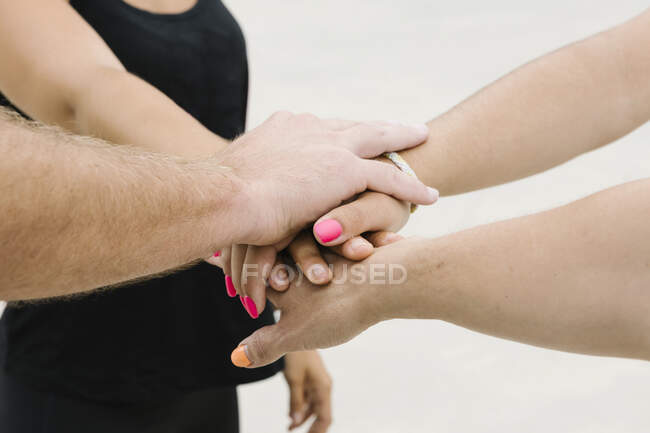 Closeup group of healthy people's hands giving group high five — Stock Photo