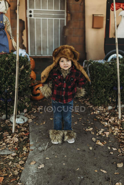 Preschool aged girl dressed as wolf man posing in costume at Halloween — Stock Photo