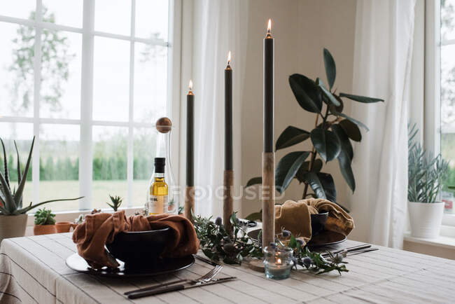 Beautiful composition of spa and elegant table with candles and flowers — Stock Photo