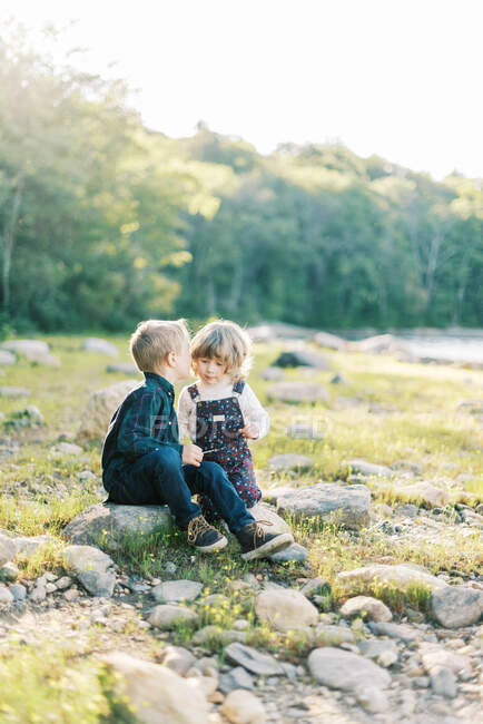 Happy children outdoor. brother and sister on nature background — Stock Photo