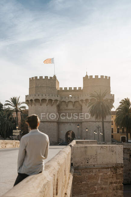 Valencia's Torres de Serrano at sunset with a young man — Stock Photo