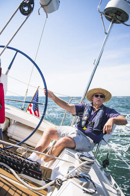 Middle Aged Man Sailing on a sunny day — Stock Photo