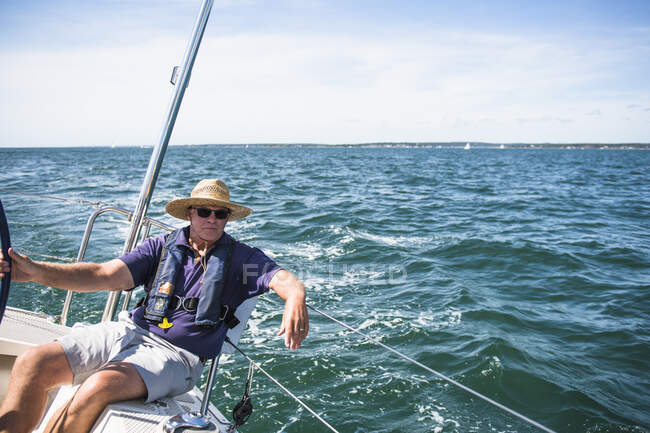 Middle Aged Man Sailing on a sunny day — Stock Photo