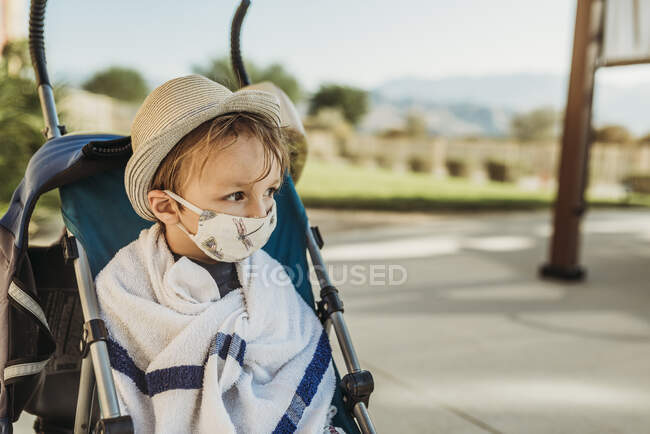 Portrait of young boy with mask on outside on vacation — Stock Photo