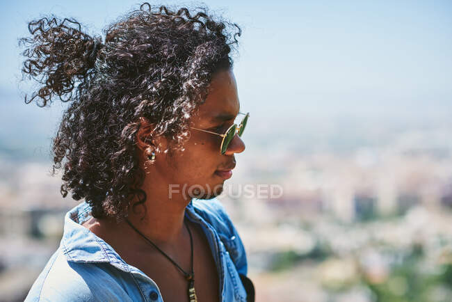 Portrait of young attractive man with dark skin. He is a musician from Latin America. — Stock Photo
