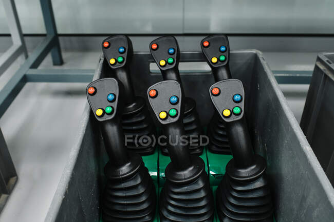 Lever-shaped plastic objects placed inside a box — Stock Photo
