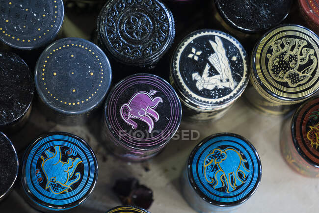 Top view of painted containers for cigars on display in cheroot cigar making workshop, Lake Inle, Myanmar — Stock Photo