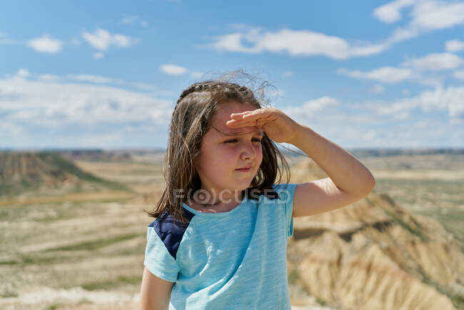 Girl wearing a blue blouse posing in the Bardenas Reales national park in Navarra, Spain. Tourism concept — Stock Photo