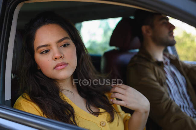 Handsome girl and man travelling together on a road trip while driving — Stock Photo