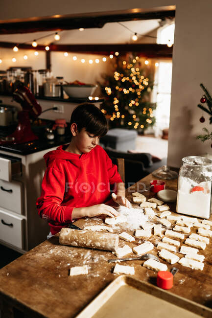 Hands of child making shortbread cookies — Stock Photo
