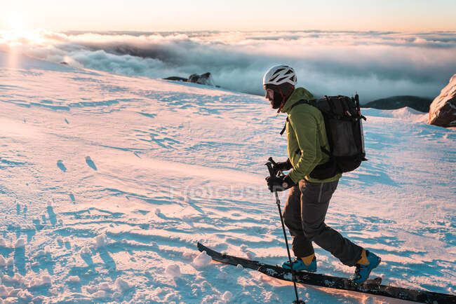 Snowboarder touring in backcountry during sunrise on Mount Hood — Stock Photo