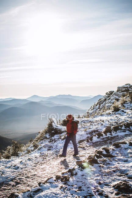 Hiker walks on frozen trail in winter Franconia Ridge New Hampshire — Stock Photo
