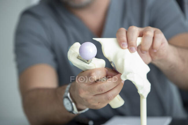 Cropped shot of doctor wiping ultrasound tool in hospital — Stock Photo
