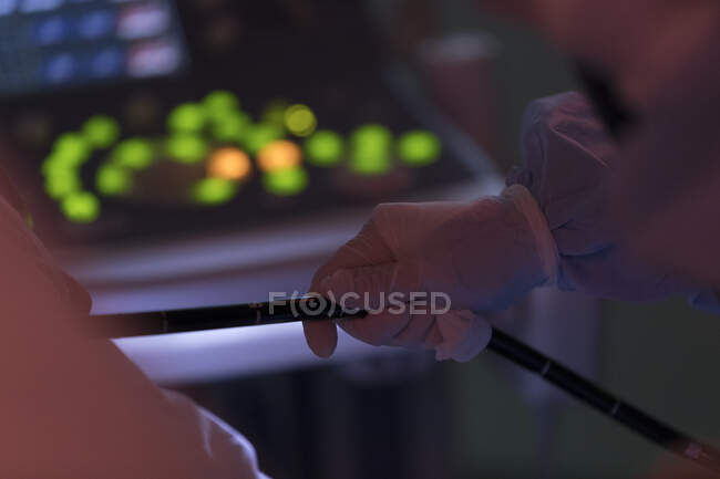 Cropped shot of surgeon holding medical pipe — Stock Photo