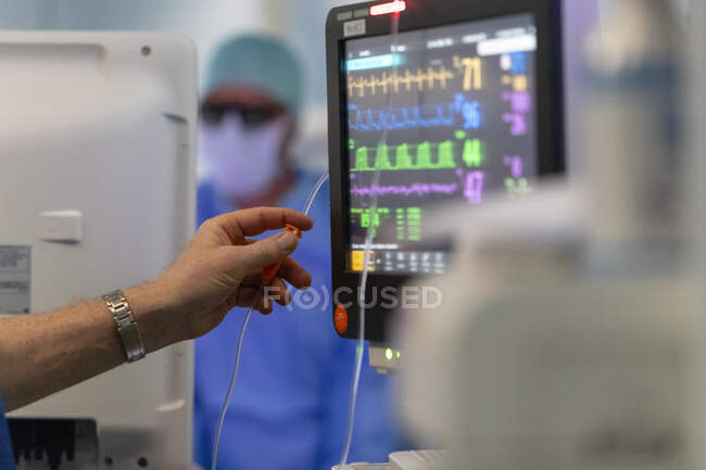 Close-up of a male doctor working with a computer monitor — Stock Photo