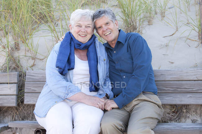 Married couple in their Seventies showing affection at Cold Storage Beach on Cape Cod — Stock Photo