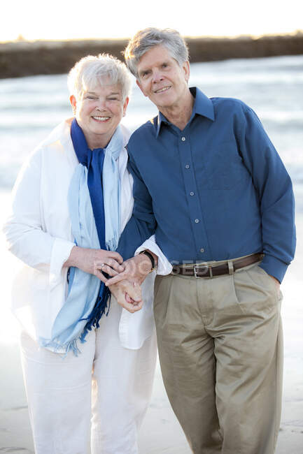 Portrait of older married couple holding hands at Beach on Cape Cod — Stock Photo