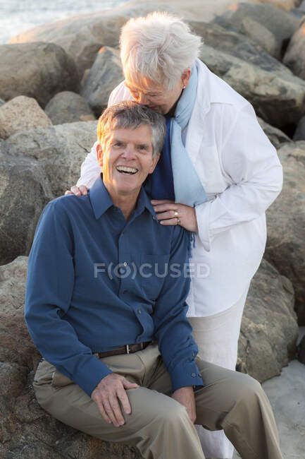 Senior wife kissing husband at Cold Storage Beach on Cape Cod — Stock Photo