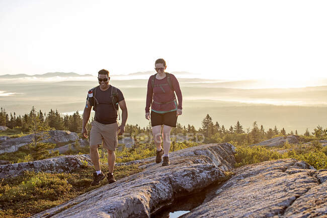 Couple hike on summit of Moxie Mountain at sunrise, Appalachian Trail — Stock Photo