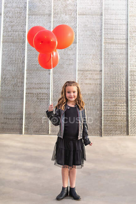 Little girl with a big smile in her hands — Stock Photo
