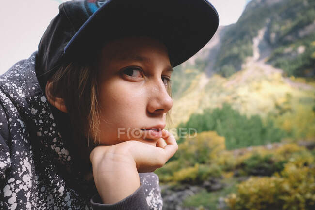 Close up shot of kid on a hike looking bored. — Stock Photo