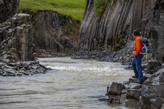 Mature man exploring Studlagil canyon in north east Iceland — Stock Photo