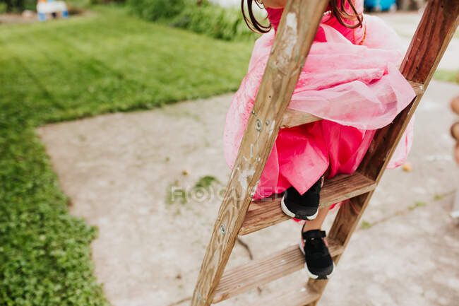 Woman sitting on the swing with her hands — Stock Photo