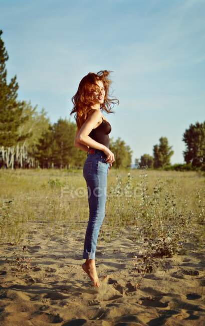 Close-up of a young woman jumping in the park — Stock Photo