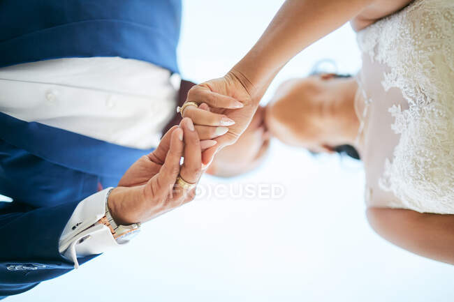 Wedding couple holding hands POV above — Stock Photo