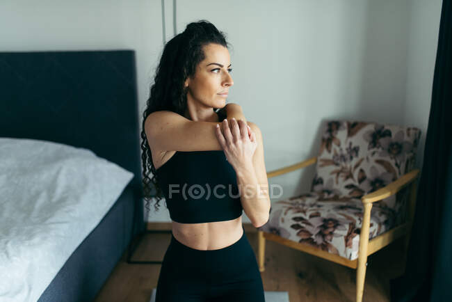 Portrait of attractive young woman  streching — Stock Photo
