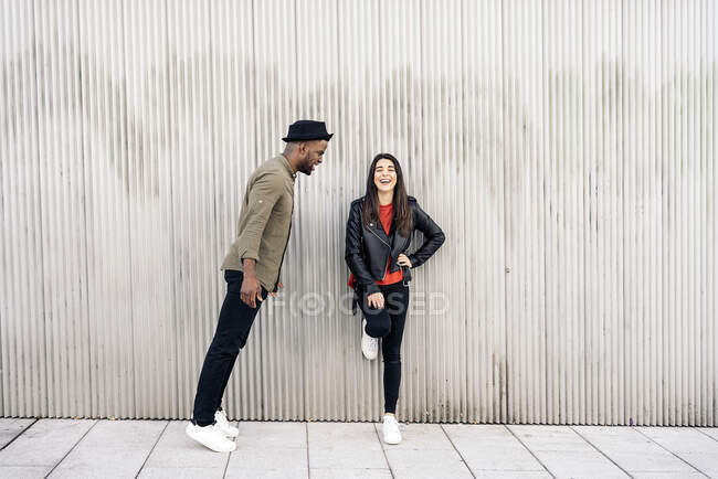 Young couple having romantic moments together in the street. Multicultural couple concept — Stock Photo