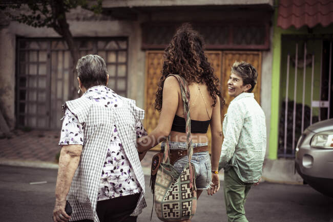 Mexican female family walk local street in summer — Stock Photo