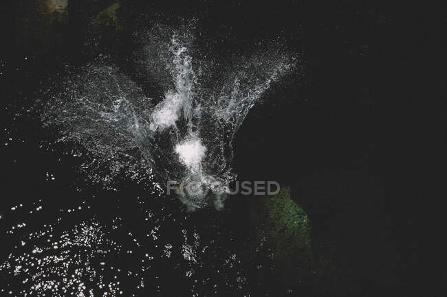 Water Sprays Upward from a Large Splash. Figure Obscured — Stock Photo