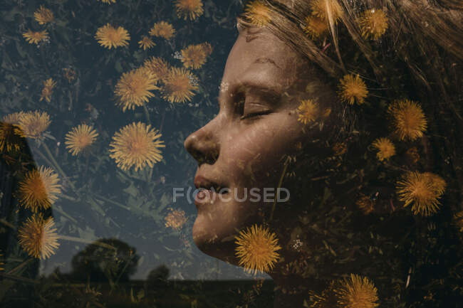 Portrait of a girl in summer in dandelions — Stock Photo