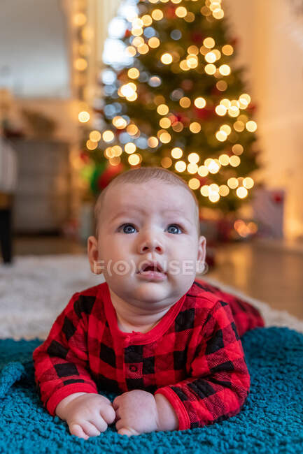 Baby boy experiencing his first Christmas. — Stock Photo