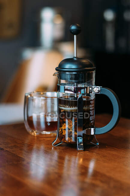 French press and glass with cascara — Stock Photo